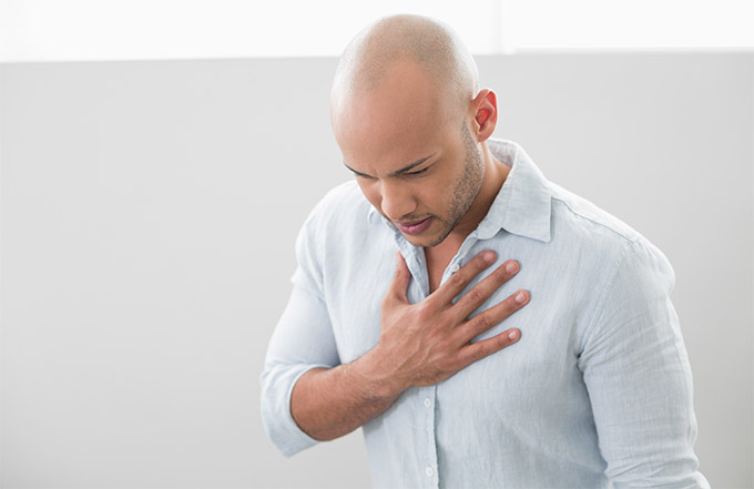 man experiencing heartburn (GERD)