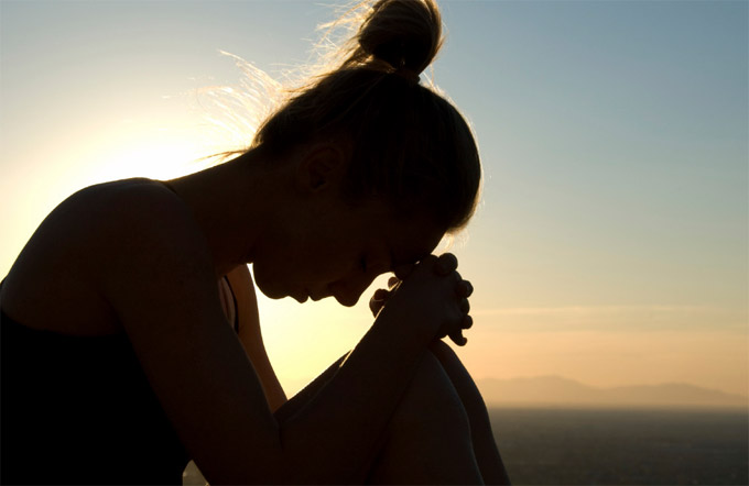 worried woman trying to calm her stress